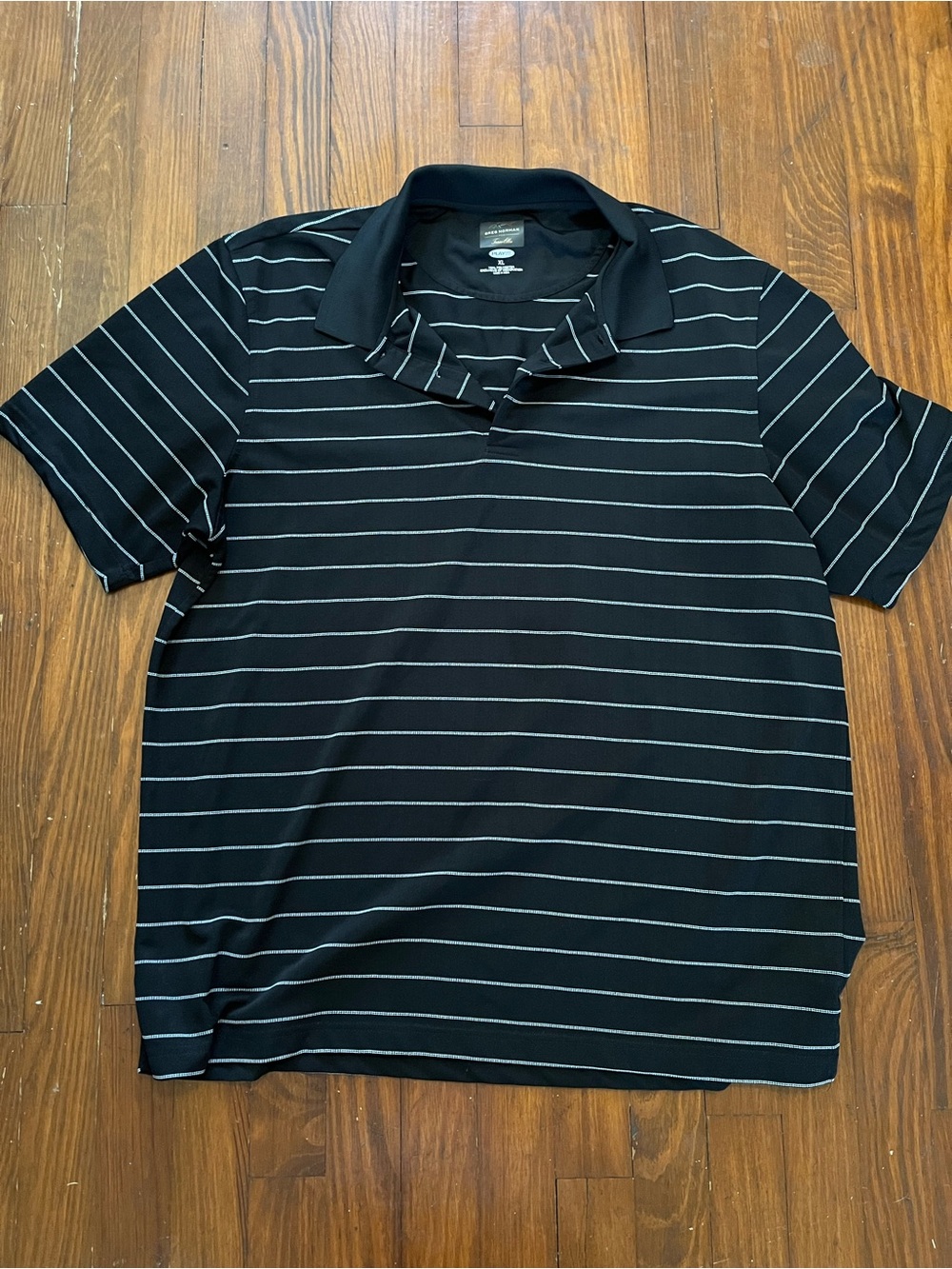 Greg Norman Collection Black Polo with Thin White Stripes